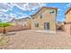 The backyard includes desert landscaping, a concrete patio and block wall at 6381 Pronghorn Ridge Ave, Las Vegas, NV 89122