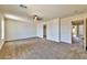 Spacious bedroom boasts neutral carpet, ceiling fan, walk-in closet and natural light at 6381 Pronghorn Ridge Ave, Las Vegas, NV 89122