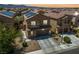 Aerial view of a two-story home, showcasing the neighborhood's layout with solar panels on neighboring roofs at 6409 Dundock Ave, Las Vegas, NV 89122