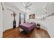 Comfortable bedroom with hardwood floors, neutral walls, and a ceiling fan at 6409 Dundock Ave, Las Vegas, NV 89122