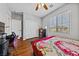 Bright bedroom offers natural light, closet, and wood floors at 6409 Dundock Ave, Las Vegas, NV 89122