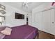 Spacious bedroom featuring wood floors, neutral walls, and access to a closet at 6409 Dundock Ave, Las Vegas, NV 89122