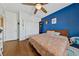 Bright bedroom featuring wood floors and lots of natural light at 6409 Dundock Ave, Las Vegas, NV 89122