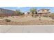 Well-maintained community with desert landscaping and walking paths at 6409 Dundock Ave, Las Vegas, NV 89122