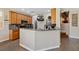 Modern kitchen features granite countertops, stainless steel appliances, and a functional breakfast bar area at 6409 Dundock Ave, Las Vegas, NV 89122