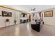 Stylish living room with tile flooring, comfortable seating, and tasteful decor create inviting space at 6409 Dundock Ave, Las Vegas, NV 89122