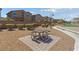 Community picnic area offers a table with seating and a barbecue grill for outdoor gatherings at 6409 Dundock Ave, Las Vegas, NV 89122