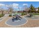 Community picnic area provides tables with benches, surrounded by landscaped grounds and walking paths at 6409 Dundock Ave, Las Vegas, NV 89122