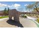 Community playground with a climbing rock, splash pad, and seating areas, perfect for Gathering fun at 6409 Dundock Ave, Las Vegas, NV 89122
