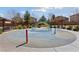Community splash pad featuring colorful rainbow arches and playful water features for children at 6409 Dundock Ave, Las Vegas, NV 89122