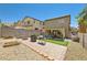 Spacious backyard features a paved patio, artificial grass, BBQ, and block wall, perfect for entertaining at 6424 Strongbow Dr, Las Vegas, NV 89156