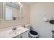 Neutral bathroom with single vanity, a mirror, and toilet at 6424 Strongbow Dr, Las Vegas, NV 89156