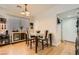 Bright dining area features a modern table set, hardwood floors, and a built-in bar area at 6424 Strongbow Dr, Las Vegas, NV 89156