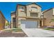 Lovely two-story residence showcasing a well-kept lawn and an attached two-car garage at 6424 Strongbow Dr, Las Vegas, NV 89156