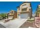 Inviting two-story home with a wide driveway and manicured landscaping at 6424 Strongbow Dr, Las Vegas, NV 89156