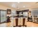 Well-equipped kitchen with stainless steel appliances, a central island, and ample cabinet space at 6424 Strongbow Dr, Las Vegas, NV 89156