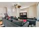 Spacious living area featuring a sectional sofa, hardwood floors, and staircase at 6424 Strongbow Dr, Las Vegas, NV 89156