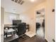 Upstairs office space with wood flooring, desk, and a view of the primary bedroom at 6424 Strongbow Dr, Las Vegas, NV 89156
