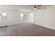 Bright, open living area with plush carpeting and ample natural light at 6749 Violet Cascade Ave, Las Vegas, NV 89156