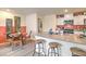 Bright kitchen features an island with bar seating, modern appliances, and a cozy dining area at 6918 Wrightshire St # 24, Las Vegas, NV 89166