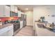 Modern kitchen with stainless steel appliances, white cabinets, and sleek countertops at 6918 Wrightshire St # 24, Las Vegas, NV 89166