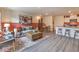 Spacious living room with modern decor, a large rug, and an open layout connecting to the kitchen at 6918 Wrightshire St # 24, Las Vegas, NV 89166