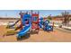 Community playground with colorful play structure and slides, perfect for families and outdoor recreation at 6918 Wrightshire St # 24, Las Vegas, NV 89166