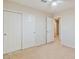 This bedroom includes a sliding door closet, fan, carpet and natural light from a window at 7363 San Pablin St, Las Vegas, NV 89139