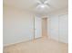Neutral bedroom featuring a fan, carpet, and an open door leading to a closet at 7363 San Pablin St, Las Vegas, NV 89139