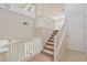 Bright entryway with tiled floors, carpeted stairs and white banister at 7363 San Pablin St, Las Vegas, NV 89139