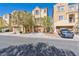 Inviting exterior of townhomes featuring desert landscaping and attached garages at 7363 San Pablin St, Las Vegas, NV 89139