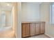 Hallway with built in storage cabinets on carpeted floors and natural lighting at 7363 San Pablin St, Las Vegas, NV 89139
