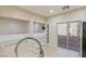 Kitchen featuring stainless steel appliances, tile flooring and light beige counter tops at 7363 San Pablin St, Las Vegas, NV 89139
