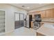 Well-lit kitchen featuring stainless steel appliances and a sliding glass door at 7363 San Pablin St, Las Vegas, NV 89139