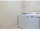 Bright laundry room with a Maytag washer and dryer, and a wire shelf at 7363 San Pablin St, Las Vegas, NV 89139
