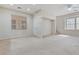 Spacious living room with carpet and multiple windows allowing for plenty of light at 7363 San Pablin St, Las Vegas, NV 89139