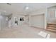 Spacious living room with carpet and natural light, adjacent to a kitchen at 7363 San Pablin St, Las Vegas, NV 89139