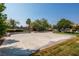 Community basketball court surrounded by trees and grass at 7491 Speedwell Cavern St, Las Vegas, NV 89139