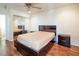 Bedroom featuring modern bed, mirrored closet and ceiling fan at 7491 Speedwell Cavern St, Las Vegas, NV 89139