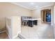 Dining area with a large table, neutral walls, recessed lighting, and tile floors at 7491 Speedwell Cavern St, Las Vegas, NV 89139