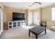 Well-lit living room with tile floors, recessed lighting, and neutral walls at 7491 Speedwell Cavern St, Las Vegas, NV 89139