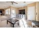 Bright living room boasts tile floors, recessed lighting, and a large window for natural light at 7491 Speedwell Cavern St, Las Vegas, NV 89139