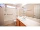 Bathroom featuring a shower over the bathtub and a single sink vanity at 7500 Peaceful Brook St, Las Vegas, NV 89131