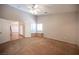 Bedroom with carpeted floors and a window bench for relaxing with natural light at 7500 Peaceful Brook St, Las Vegas, NV 89131