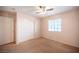 Bedroom featuring carpeted floors, a ceiling fan, and a closet with sliding doors at 7500 Peaceful Brook St, Las Vegas, NV 89131