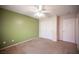 Bedroom featuring carpeted floors, a ceiling fan, and a closet with sliding doors at 7500 Peaceful Brook St, Las Vegas, NV 89131
