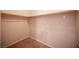 Uncluttered walk-in closet with carpet and shelving for organization and storage at 7500 Peaceful Brook St, Las Vegas, NV 89131