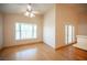 Sunny dining area with vaulted ceiling and bay window at 7500 Peaceful Brook St, Las Vegas, NV 89131