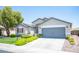 Well-maintained single-Gathering house featuring a two-car garage and lush front yard at 7500 Peaceful Brook St, Las Vegas, NV 89131