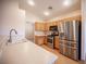 Bright kitchen featuring stainless steel appliances and light wood cabinets at 7500 Peaceful Brook St, Las Vegas, NV 89131